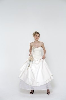Full length of bride wearing luxurious wedding dress 