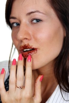 Girl eating a chocolate candy 