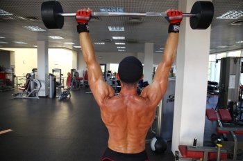 man with weight training equipment on sport gym club 

