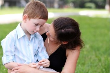 Happy mother and her little son outdoors session 