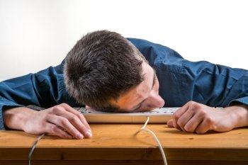 young man sleeping on the computer, sleeping on work