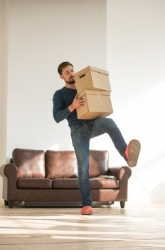 Man carrying stacked boxes on moving day