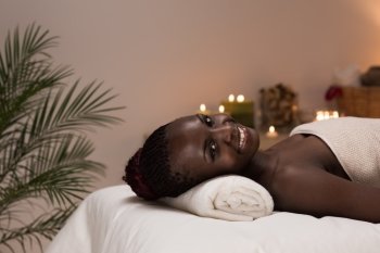 Spa African Woman in Beauty Salon Relaxing