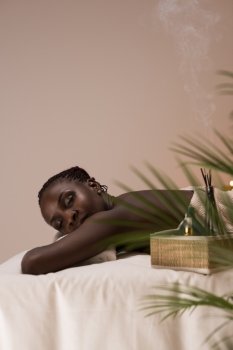 Spa African Woman in Beauty Salon Relaxing