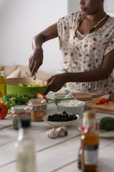 Young Unrecognizable African Woman Cooking. Healthy Food - Vegetable Salad. Diet. Dieting Concept. Healthy Lifestyle. Cooking At Home. Prepare Food