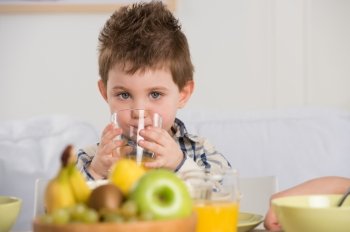 Child on breakfast - drinking juice