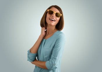 Portrait of a positive girl wearing sunglasses 