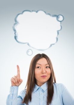Beautiful asian business woman have good idea, including thought bubble with copy space on grey background