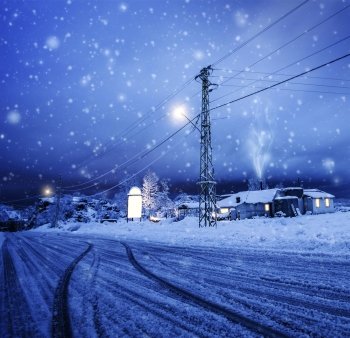 Photo of blizzard in the village, snow falling on the house, night wintertime landscape, Christmastime greeting card, winter holiday, luxury ski resort, cozy homes in Lebanon, Xmas vacation concept