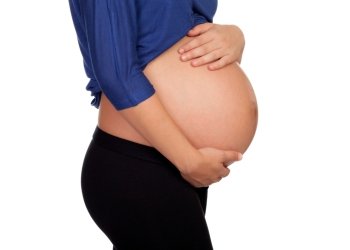 Pregnant woman isolated on a white background