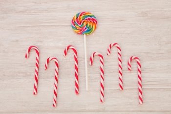 Nice round lollipop with many colors in a spiral and candy canes