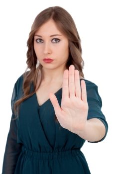 Serious woman asking to stop with the focus on the hand isolated on a white background