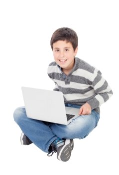 Happy boy with the laptop isolated on a white background