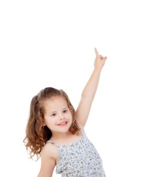 Happy little girl indicating something with the finger isolated on a white background