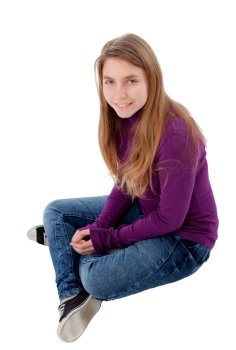 Adorable blonde teenager looking at camera sitting on floor isolated on a white background