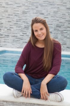 Cool young girl relaxed with the pool of background