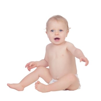 Adorable blond baby in diaper sitting on the floor isolated on a white background