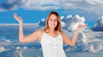 Blonde woman relaxing with a blue sky with clouds of background