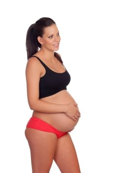 Brunette pregnant woman in underwear isolated on a white background