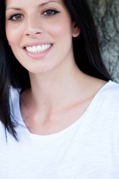 Portrait of relaxed brunette women with a perfect smile showing teeth