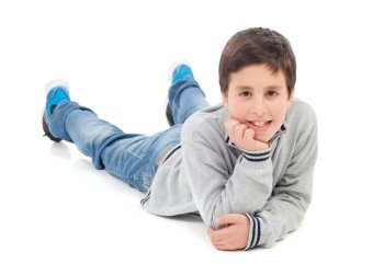 Smiling preteen boy lying on the floor isolated on a white background