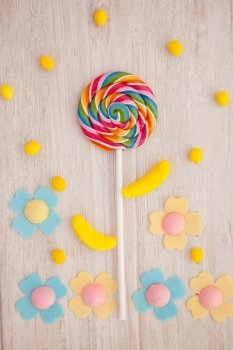 Beautiful landscape formed with a lollipop and candies resembling a flower