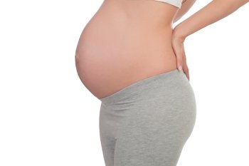Pretty pregnant woman belly isolated on a white background