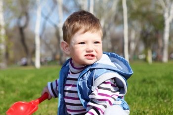 portrait of little boy in spring park