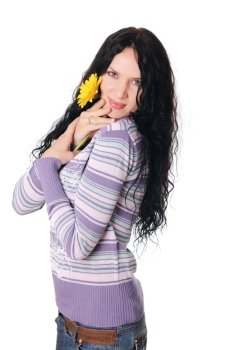 Young lovely brunette playing with a yellow flower isolated on white 