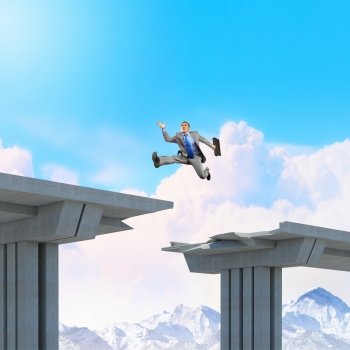 Ready to take a risk. Businessman jumping over a gap in the bridge as a symbol of bridge