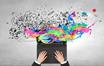 Woman use laptop. Top view of businesswoman hands using laptop and colorful splashes on screen