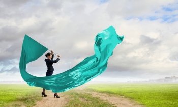 Woman waving blue flag. Determined businesswoman waving flag as symbol of power