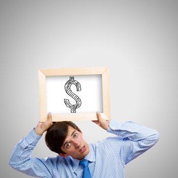 Currency concept. Handsome man holding frame with dollar sign
