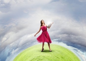 Education concept. Woman in red dress with book in hands