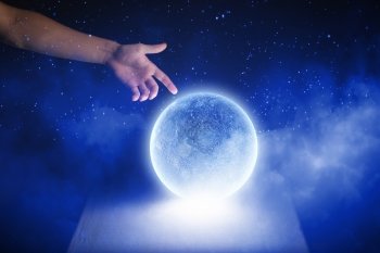 Moon planet. Close of man hands touching moon planet