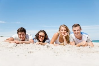 Company of young people on the beach. Company of young friends on the beach relaxing on white sand