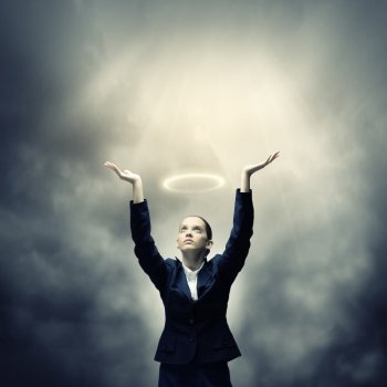 Saint businesswoman. Young crying businesswoman with halo above head