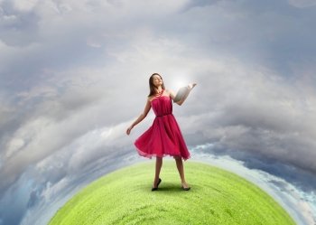 Education concept. Woman in red dress with book in hands