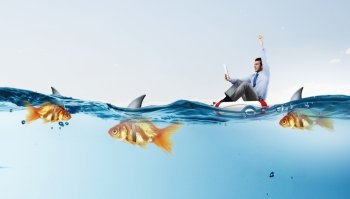 False risk for your business. Concept of fake threat when businessman float in lifebuoy and sharks in water appear to be goldfish 