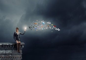 Businesswoman with mobile phone. Young businesswoman holding mobile phone with flying out icons