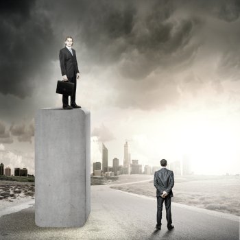 Progress in business. Businessman standing on bar and looking down at colleague
