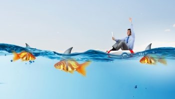 False risk for your business. Concept of fake threat when businessman float in lifebuoy and sharks in water appear to be goldfish 