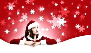 Santa girl. Girl in Santa costume with white blank banner. Place for text