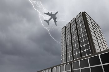 Airplane above city. Bottom view of airplane flying above skyscraper in stormy sky