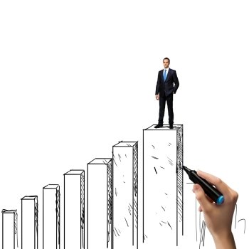 Growth concept. Successful businessman standing on drawn graph bars
