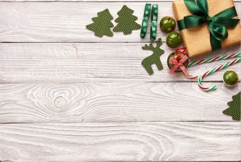 Christmas present and decoration on wooden background 