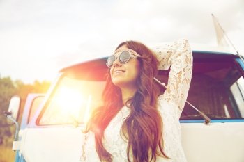 summer holidays, road trip, vacation, travel and people concept - smiling young hippie women in minivan car