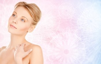 beauty, people and bodycare concept - beautiful young woman face and hands over rose quartz and serenity pattern background