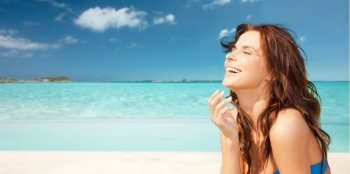 travel, tourism, summer vacation and people concept - happy beautiful woman over tropical beach background