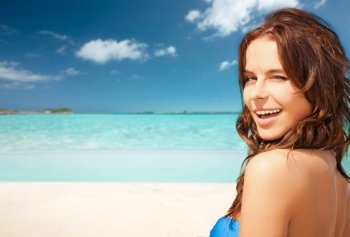 travel, tourism, summer vacation and people concept - happy beautiful woman over tropical beach background